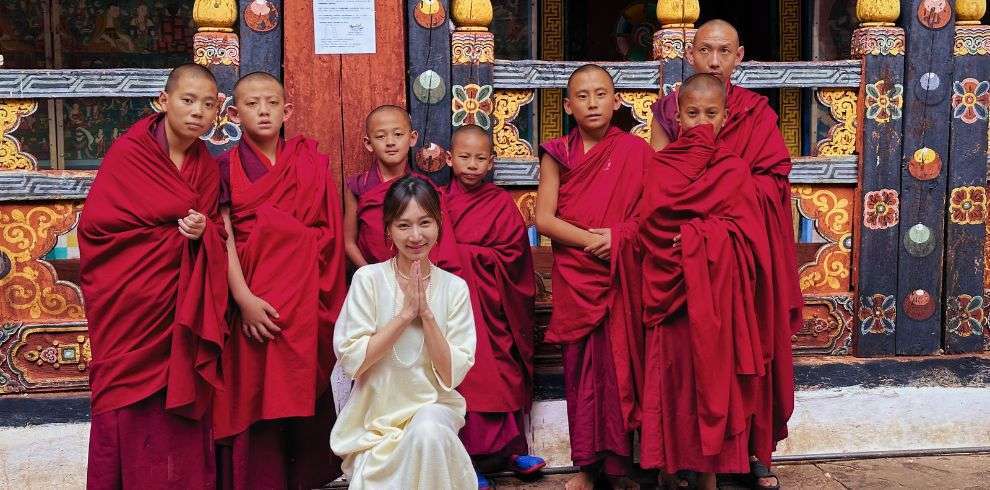 Tongli with monk in Paro Dzong in Bhutan